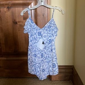 Me To We blue and white romper.